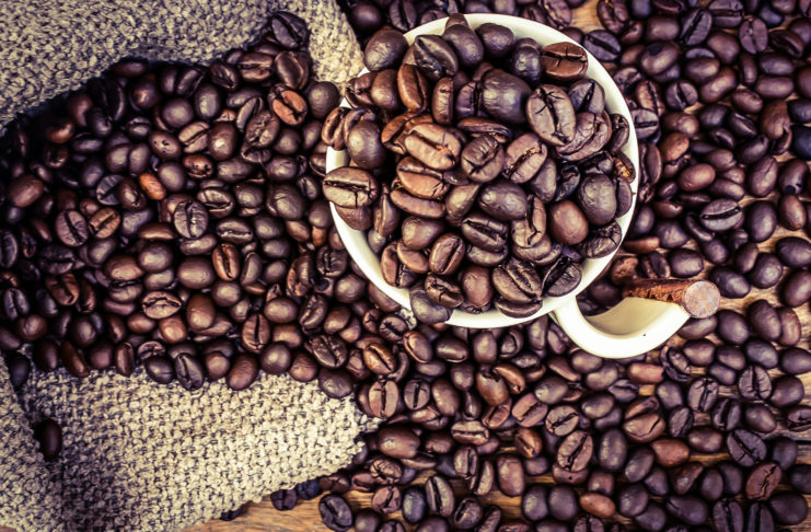 Coffee beans in a cup of coffee