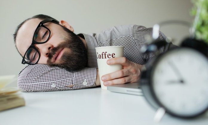Man sleeping with coffee