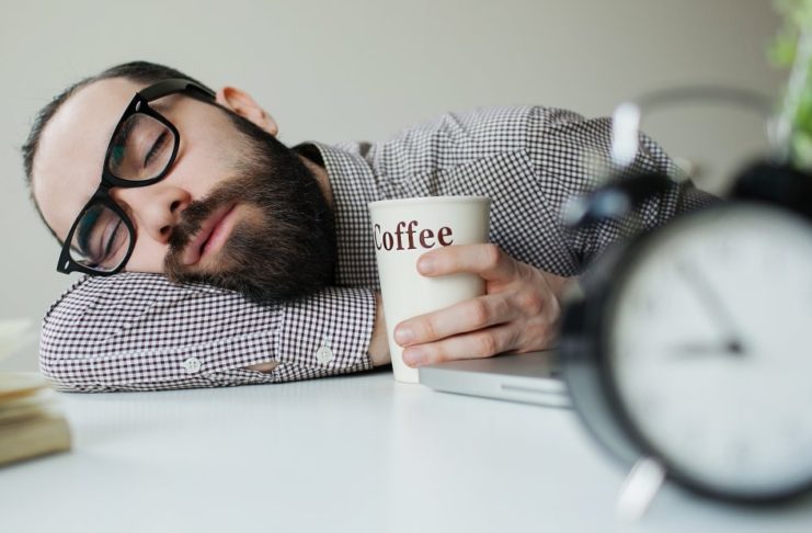 Man sleeping with coffee