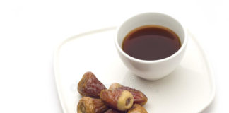 A coffee cup and dates