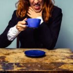 woman drinking bad coffee