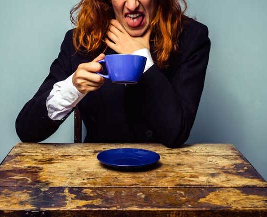 woman drinking bad coffee