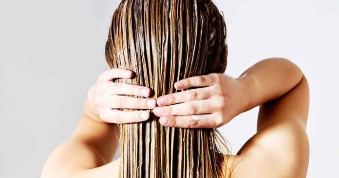 A girl applying a coffee hair mask