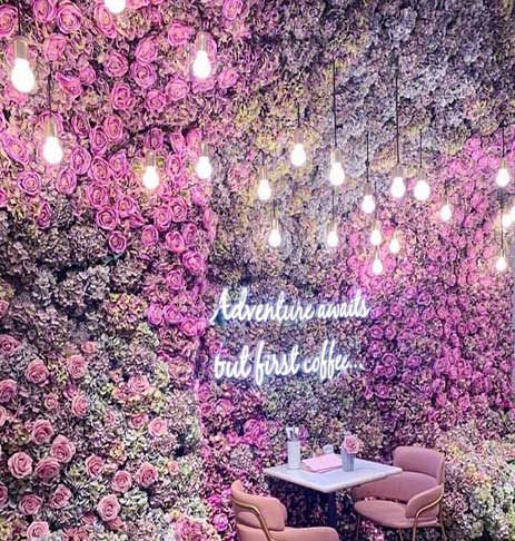 The iconic flower wall inside Elan Cafe London