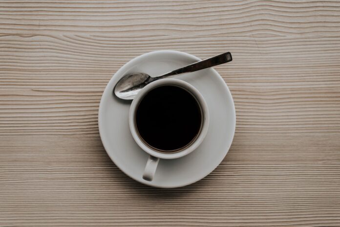 a cup of black coffee drink on the table