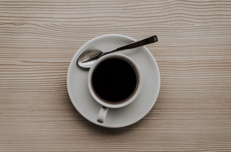 a cup of black coffee drink on the table