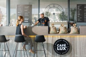 a barista talking to the customer