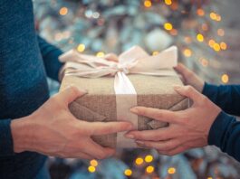 a person giving a gift