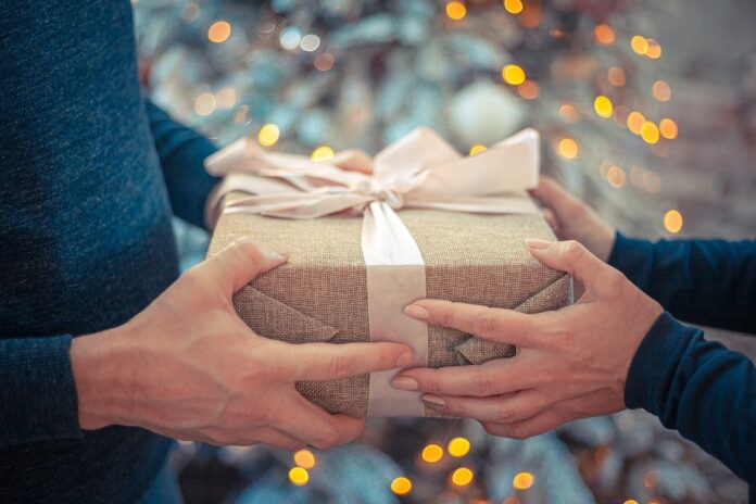 a person giving a gift