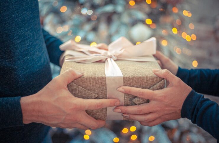 a person giving a gift