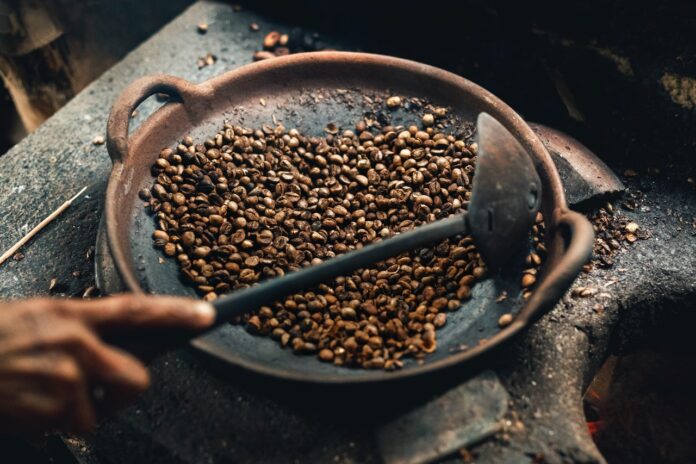 a person roasting coffee beans