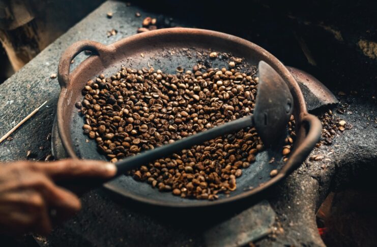 a person roasting coffee beans