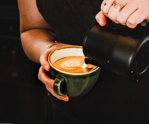 a person making coffee