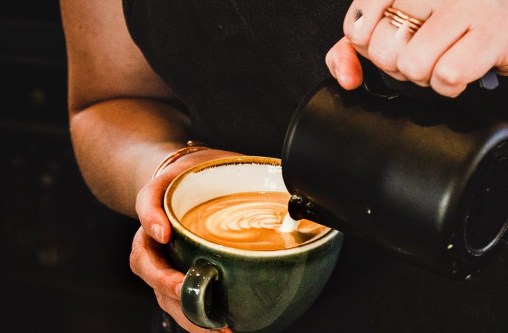 a person making coffee
